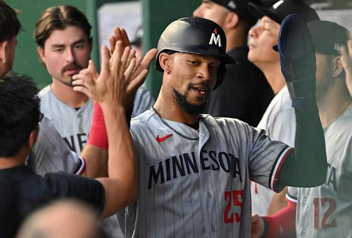 Jul 29, 2023; Kansas City, Missouri, USA; Minnesota Twins designated hitter Byron Buxton (25) celebrates in the dugout after scoring a run during the sixth inning against the Kansas City Royals at Kauffman Stadium.